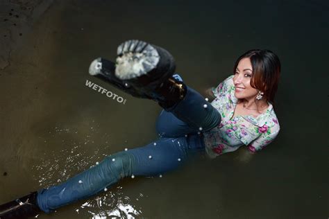 Fully Clothed Girl In Tight Jeans Shirt And Boots Get Soaking Wet On Lake