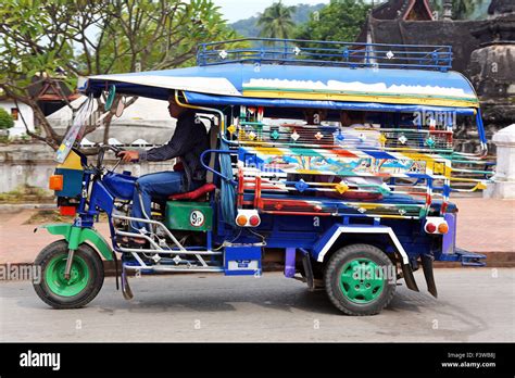 Three wheeled Tuk Tuk taxi in Luang Prabang, Laos Stock Photo - Alamy