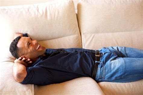 Young African Guy Resting On Couch And Smiling At Home Stock Image Image Of Indoors Casual