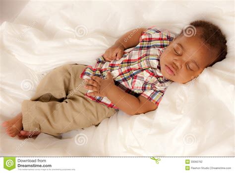 Confronted with a series of racially charged incidents, a young black man must overcome rage, alienation, and hopelessness in order to find his own humanity. Little Baby African American Boy Sleeping Stock Photo ...
