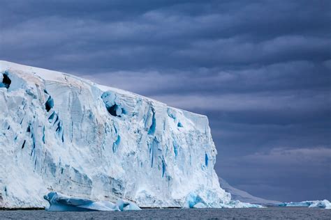 Dark Clouds Above Large Iceberg In Antarctica Fine Art Print Photos
