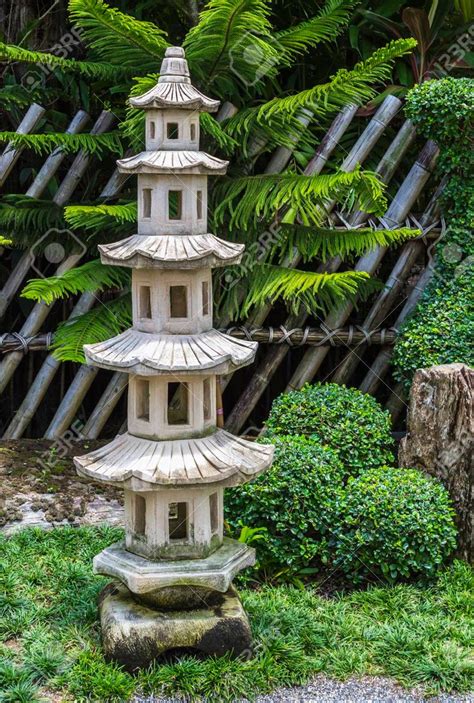 Japanese Pagoda Stone In The Tropical Garden Stock Photo Picture And