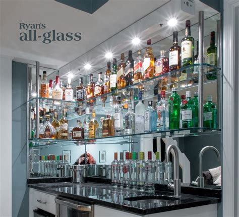 Building the shelves for your home bar first involved creating a frame on the bottom. Image result for mirrored shelves above bar | Home bar ...