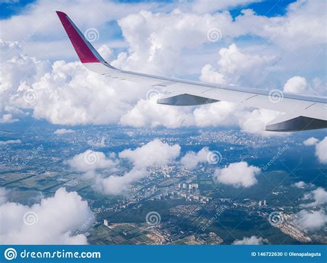 View From Airplane Window Wing Plane In Cloudy Sky Stock Photo Image