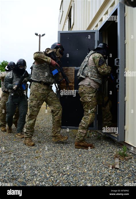 A Yuba County Sheriffs Department Swat Team Enters A House During A