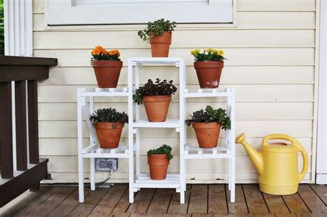 The Art Of Decorating A Front Entrance With Images Plant Stand