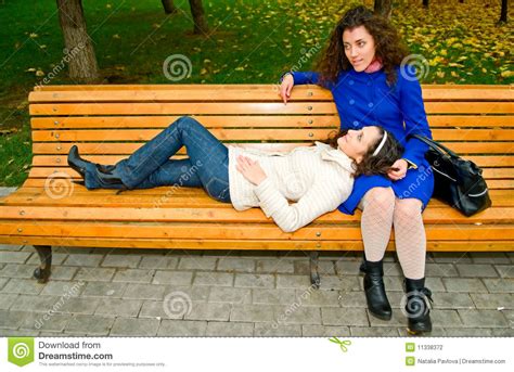 We did not find results for: Two girls on the bench stock photo. Image of caucasian ...