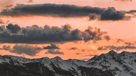 Download Wallpaper 2560x1440 Clouds Sky Sunset Porous Mountains