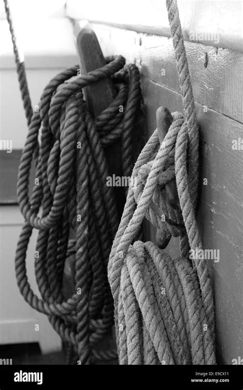 Belaying Pins With Coiled Ropes On A Tall Ship Stock Photo Alamy