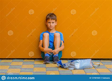 Sad Alone Boy Sitting Near Colorful Wall Outdoors Stock Image Image