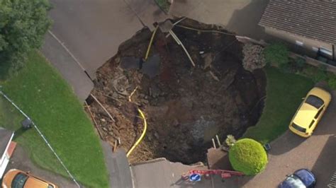 Huge Sinkhole Swallows Street In Fukuoka Japan Bbc News