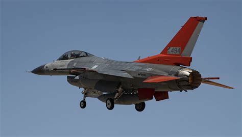 Download F 16 Fighter Jet In Red Wallpaper