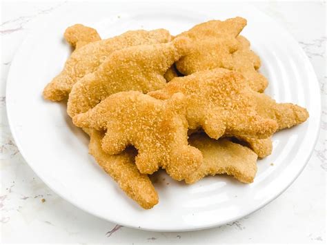 Insert the chicken nugget basket in the air fryer. Air Fryer Frozen Chicken Nuggets - Aileen Cooks