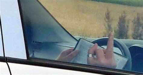 Woman Flips The Bird As Shes Filmed Reading The Bible While Driving
