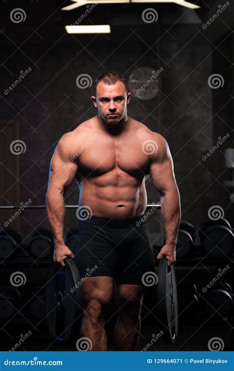 Male Bodybuilder With Naked Torso Posing In Gym Stock Image Image Of