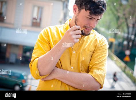Young Man Smoking Pipe On The Balcony Stock Photo Alamy