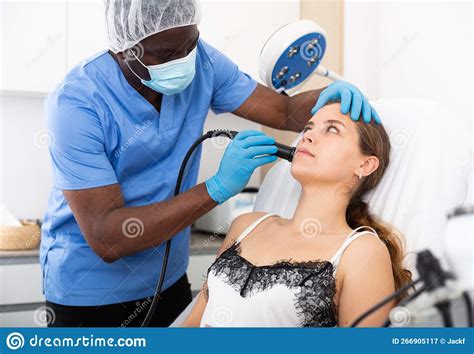 Young Woman Receiving Face Ultrasound Lifting Procedure In Clinic Stock