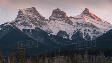 Evening Light On The Peaks Of Three Sisters Near Banff National Park