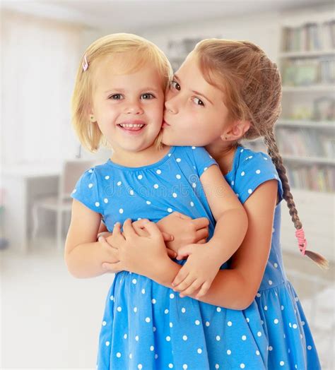two cute little sisters kiss stock images download 199 royalty free photos