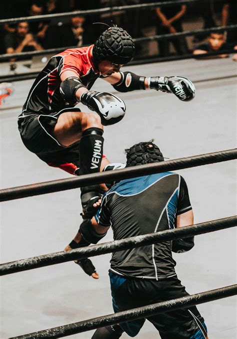 Fighter Doing Flying Kick · Free Stock Photo