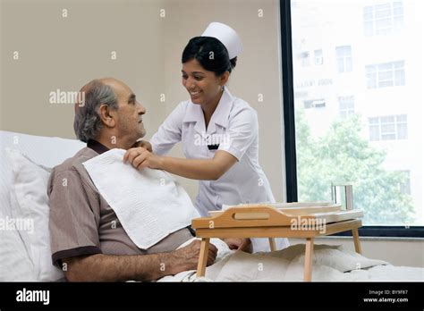 Indian Nurse Helping Patient High Resolution Stock Photography And