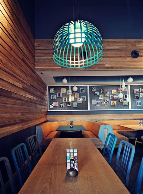 Top Restaurant Interior Designs With Wooden Walls Insertions