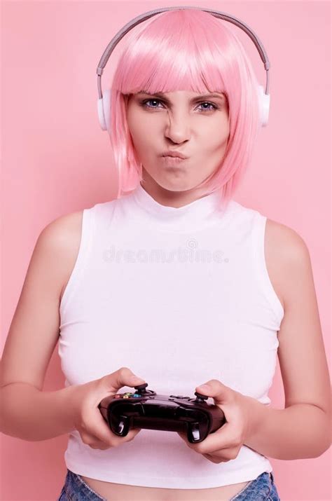 Happy Gamer Girl With Pink Hair Playing Video Games Using Joystick