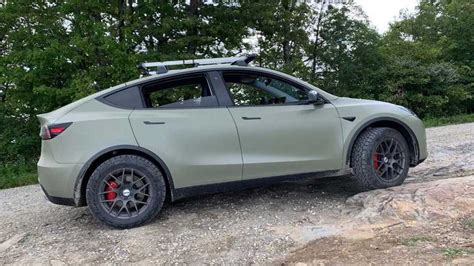 Tesla Model Y With Apparent Lift Kit And Large All Terrain Tires My