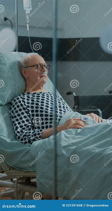Ill Patient With Nasal Oxygen Tube And Iv Drip Bag Stock Photo Image