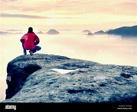 Moment Of Loneliness On Exposed Rocky Summit Man In Black Enjoy