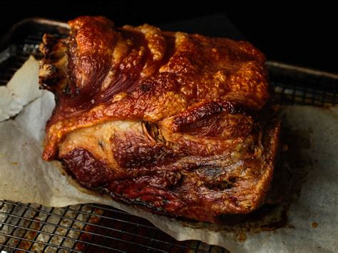 Place pork shoulder on a rack in a roasting pan. Ultra-Crispy Slow-Roasted Pork Shoulder Recipe | Serious Eats