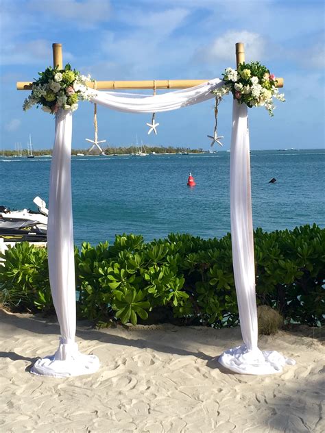 2 Post Bamboo Arch With Fabric Floral And Starfish By Love In Bloom