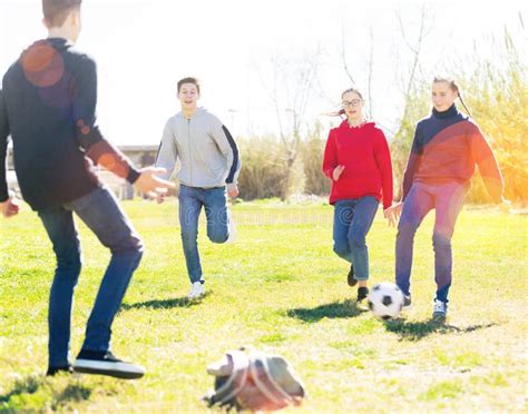 Teenagers Play Football With Excitement Stock Photo Image Of Ball