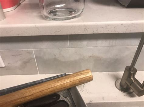 What you need to know about marble: Transparent water stain on marble backsplash