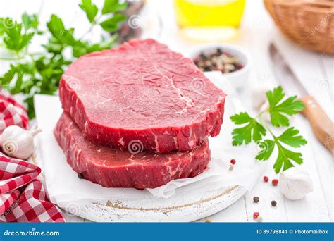 Raw Uncooked Beef Meat Steaks On White Wooden Background Stock Image