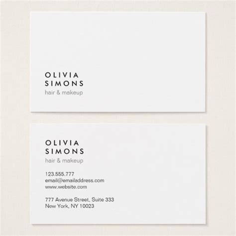 Two White Business Cards With Black Writing On The Front And Bottom