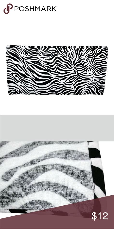 A Black And White Zebra Print Purse With The Name Poshmark Printed On It