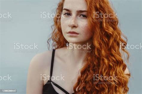 Portrait Of Woman With Red Curly Hair Stock Photo Download Image Now