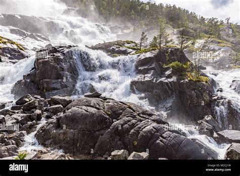Summer Mountain Langfossen Waterfall On Slope Etne Norway Stock Photo