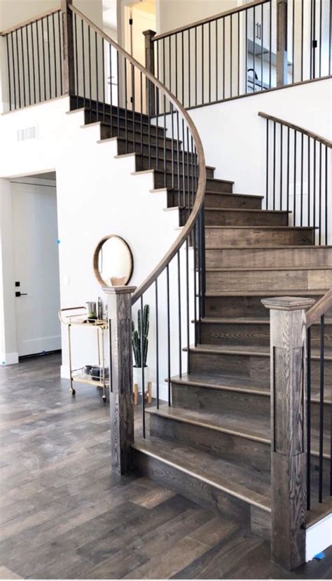 Beautiful Curved Staircase With A Metal Baluster System Stairs