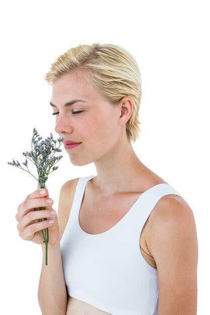 Premium Photo Gorgeous Blonde Woman Smelling Flowers
