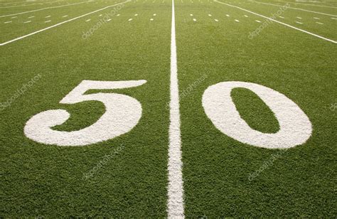 There are 98 yard lines on a football field each with its own name like the 50 yard line. American Football Field 50 Yard Line — Stock Photo ...