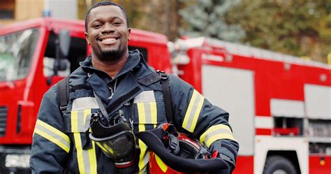 Firefighter Portrait On Duty Photo Of Happy Fireman With Gas Mask And