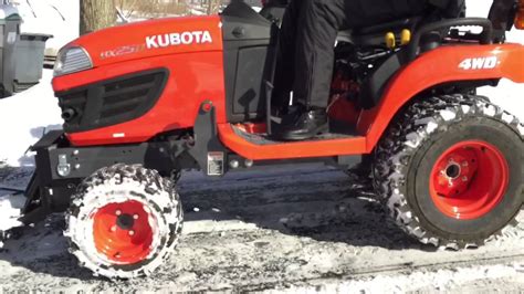 Kubota Bx Plowing Snow With A Johnny Products Plow Youtube