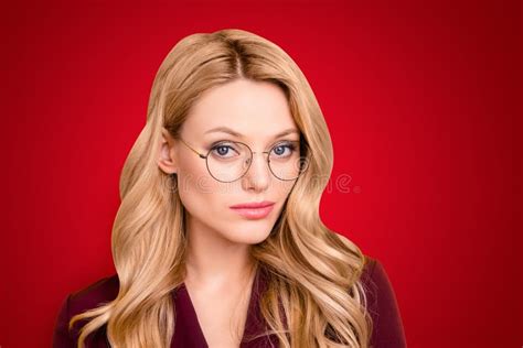 head shot portrait of attractive concentrated thoughtful woman in glasses with big eyes looking