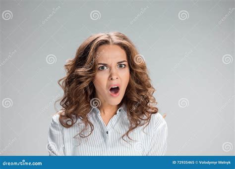 Portrait Of Young Woman With Shocked Facial Expression Stock Image