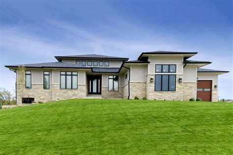 If your lot doesn't have the space to build out and around, you can build down instead! Modern Prairie-Style House Plan with Loft Overlook and ...