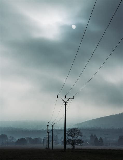 Electric Posts Under Cloudy Skies · Free Stock Photo