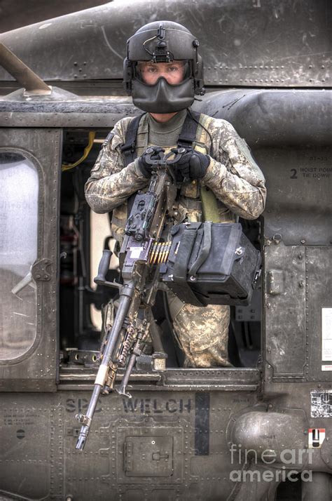 A Uh 60 Black Hawk Door Gunner Manning Photograph By Terry Moore