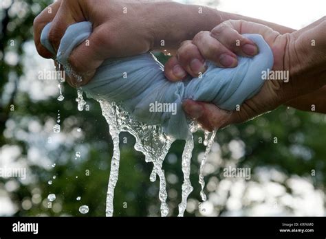 Hands Squeeze Wet Cloth Stock Photo Alamy
